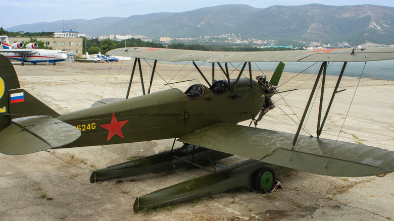 Quarter view of Russian biplane showing several wires