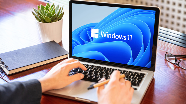 Windows 11 mascot on a laptop screen