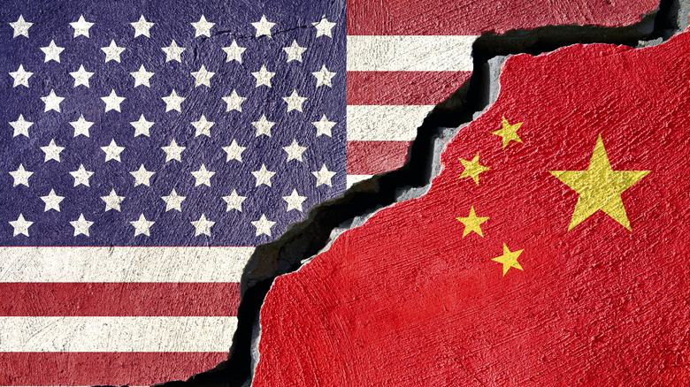 United States and Chinese national flags with a crack separating them