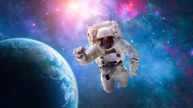 Rendering of an astronaut in space with Earth behind them