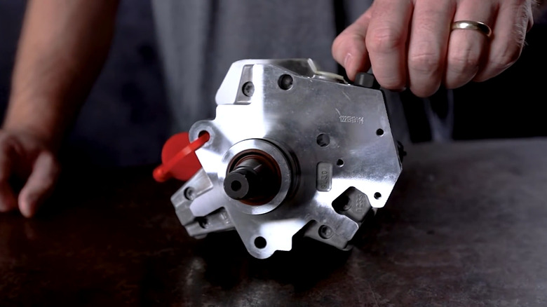 A closeup of a CP3 fuel pump on a table