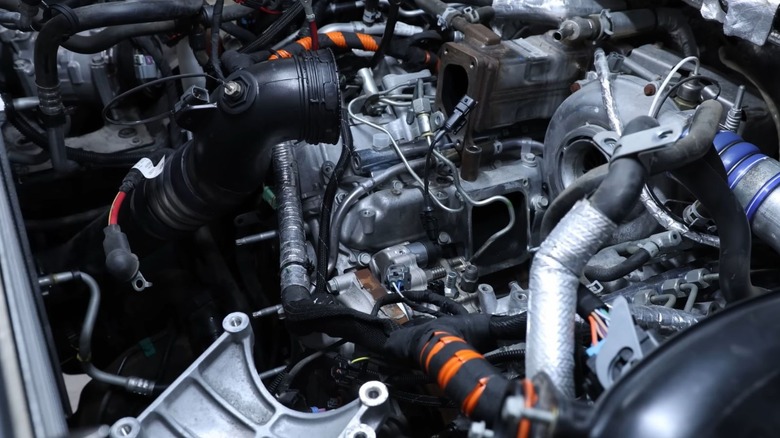 An open car engine with a freshly installed CP3 fuel pump