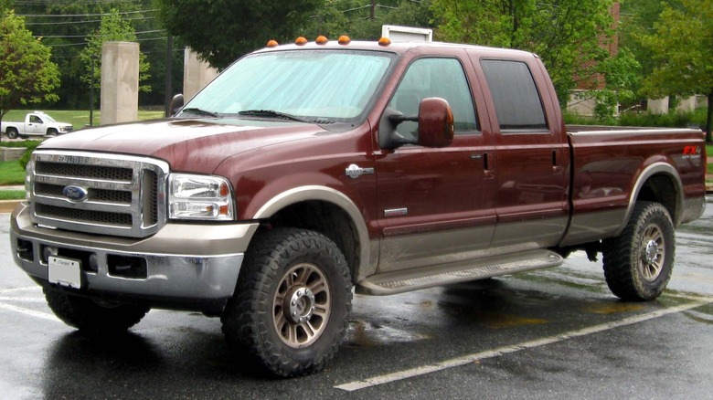 Ford F-350 King Ranch parked on a paved surface with trees in the background