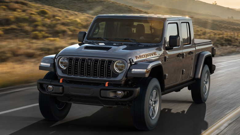 2025 Jeep Gladiator driving on road, front-left three-quarter view