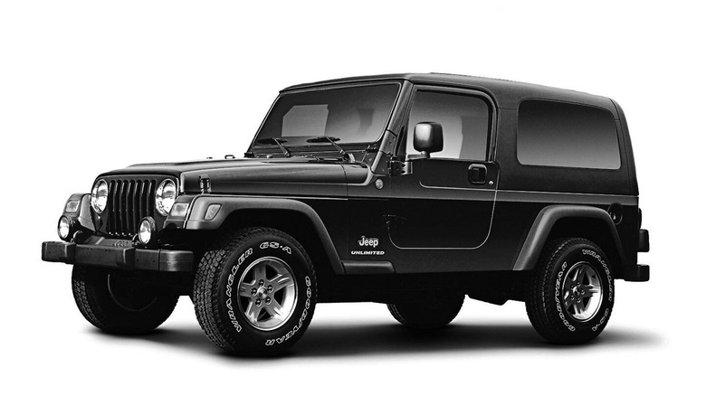 Jeep Wrangler Unlimited, black-and-white studio photograph, front-left three-quarter view