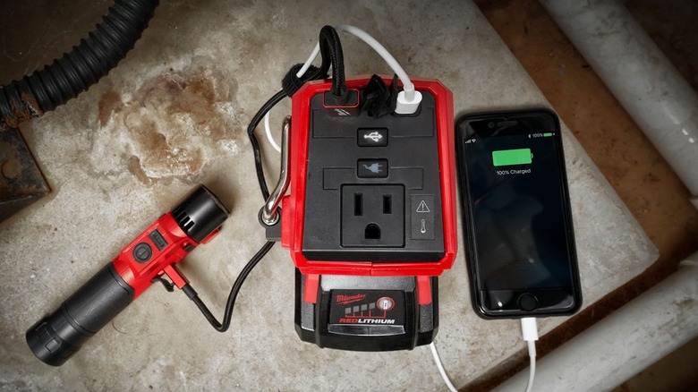 M18 Top-Off charging flashlight and iPhone