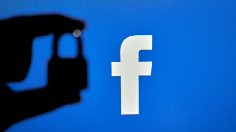 hand holding padlock facebook background