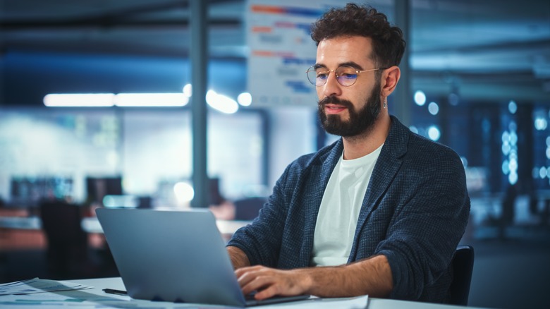 man on office laptop