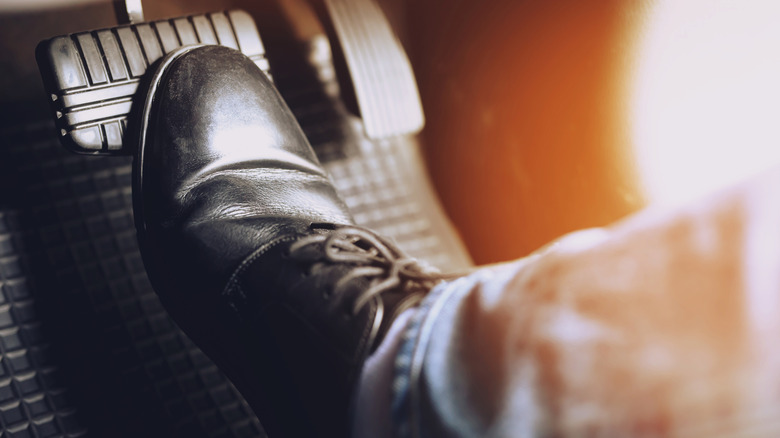 foot on the car brake pedal
