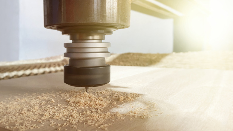 A close-up image f a CNC router cutting wood