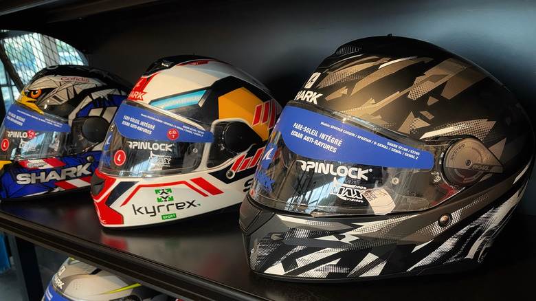 Shark full face helmets on a shelf