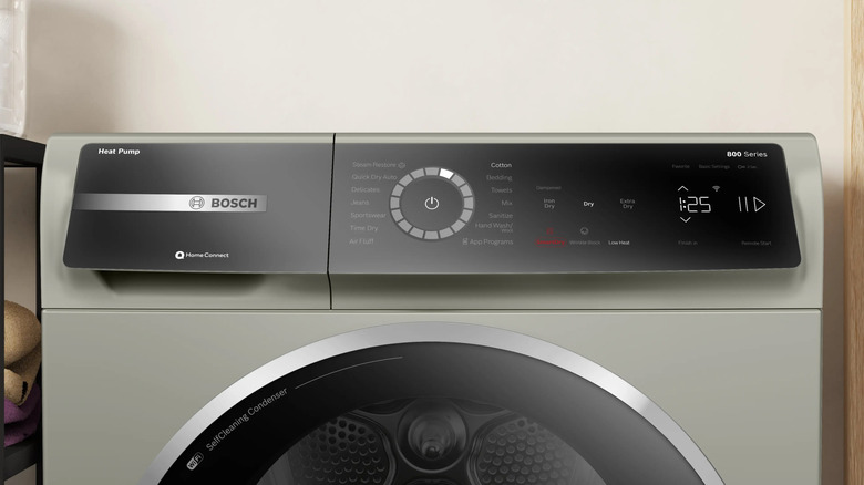 A close-up view of the top control panel on a Bosch 800 Series pearl steel heat pump dryer