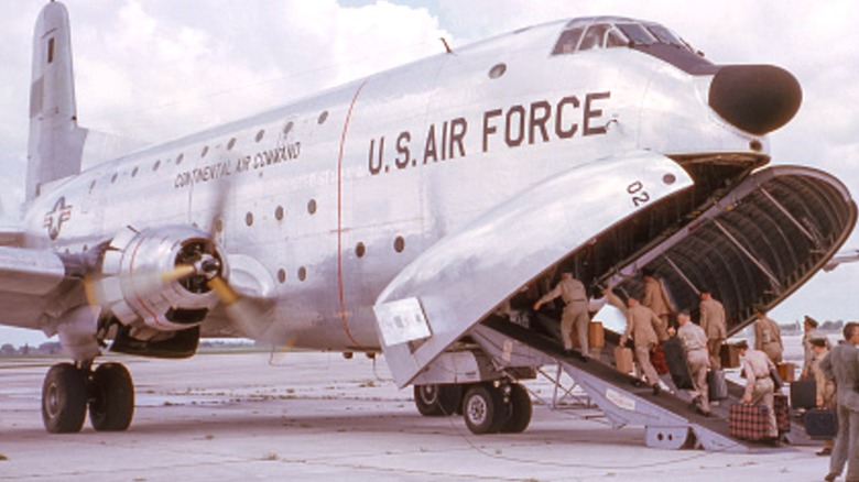 A U.S. Air Force C-124 loading personnel on a tarmac