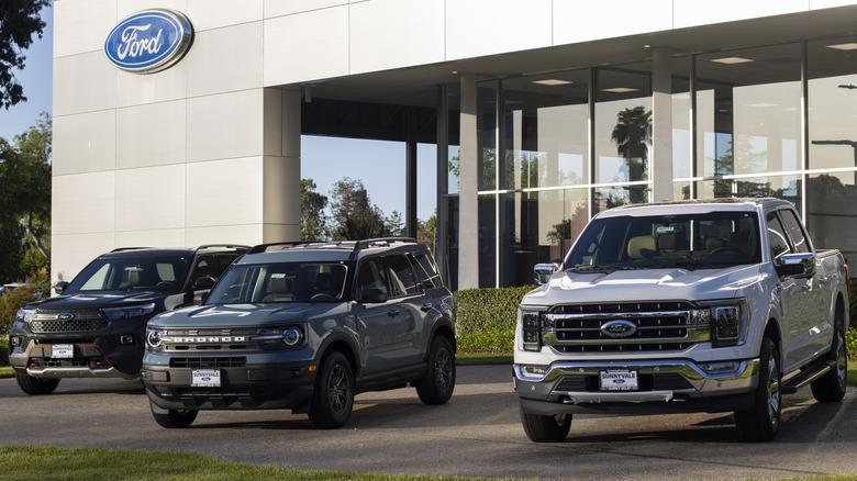 Three Ford vehicles outside a dealership