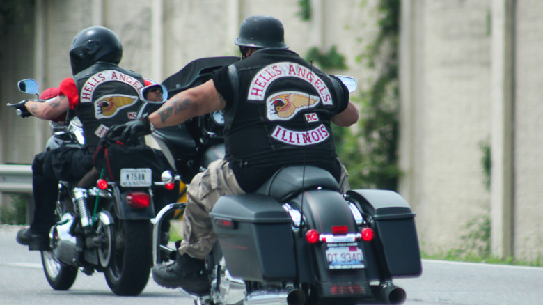 Hells Angels motorcycle club riders going down a highway.