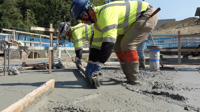 A mason works with cement