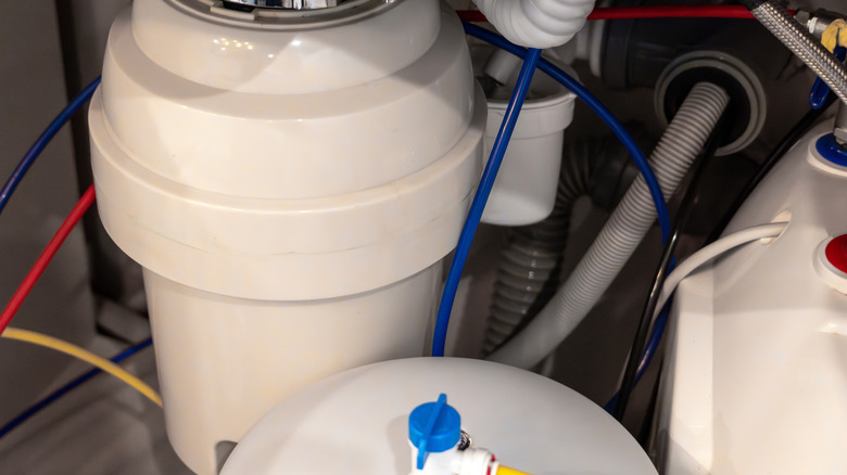 Close-up of a kitchen garbage disposal system.