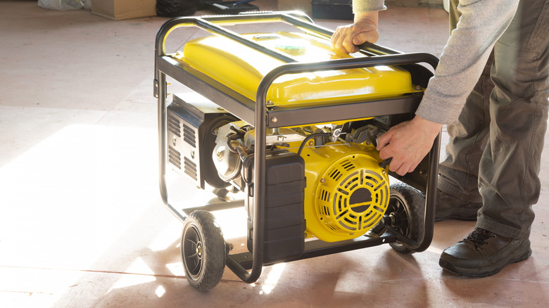 A man using a portable power generator