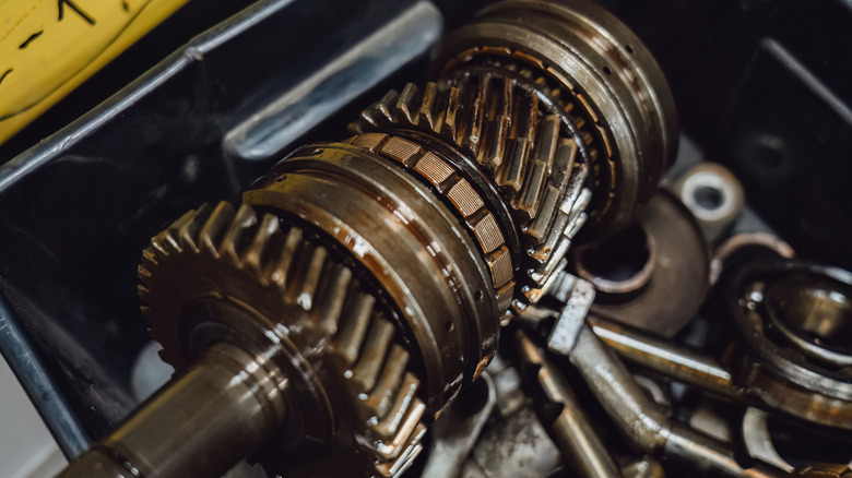 Disassembled output shaft of manual transmission showing components