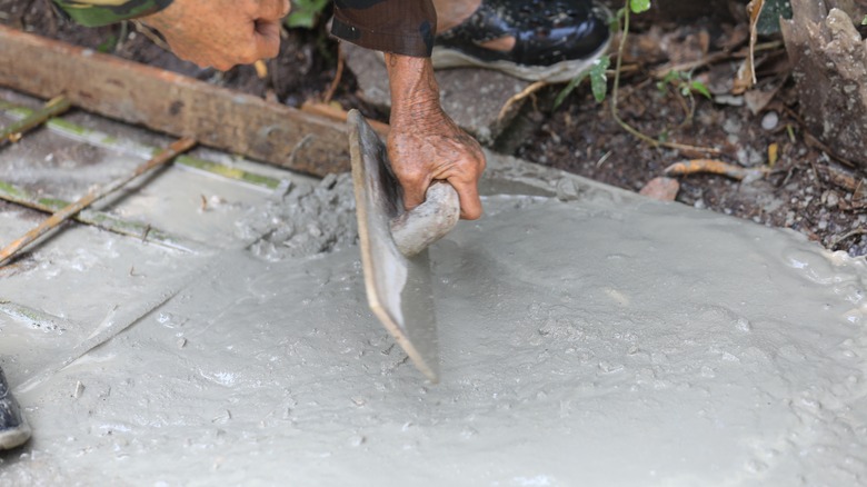 Hand trowel used to smooth wet cement