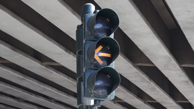 Yellow arrow lit up on stop light