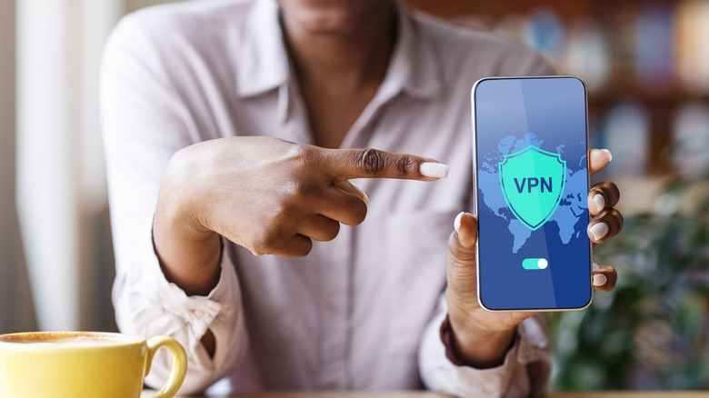 woman holding phone with vpn