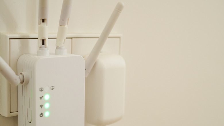 WiFi booster, repeater, or extender on white wall