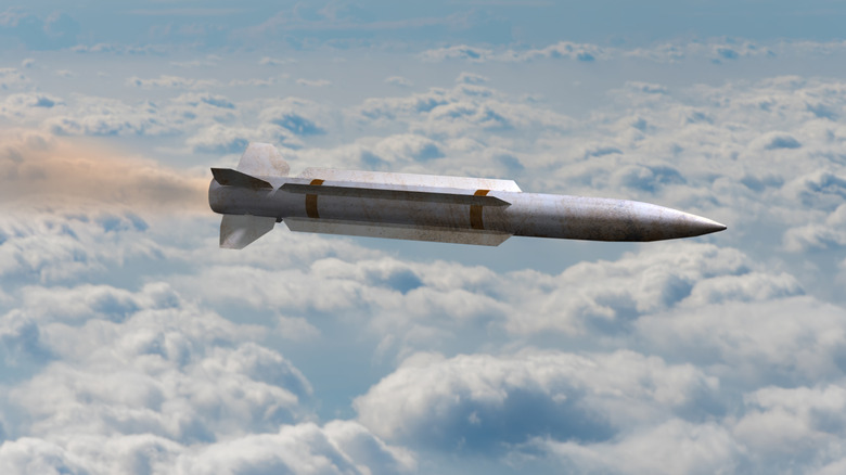 A render of a hypersonic missile flying above the clouds.