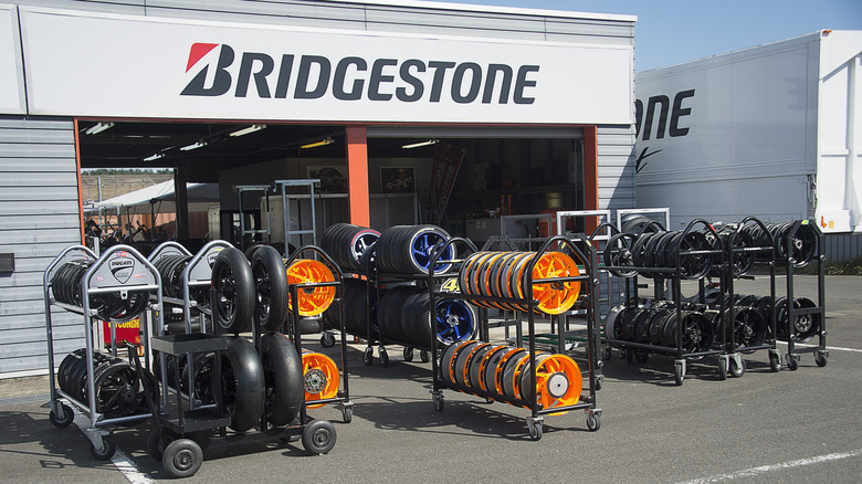 Wide view of Bridgestone tire installation garage at race track in Japan.