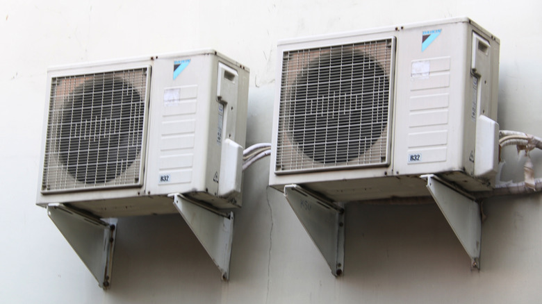 Daikin brand AC compressors outside a building