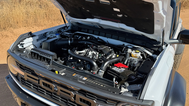 Ford Bronco Raptor with hood open showing engine bay with turbocharged V6 engine