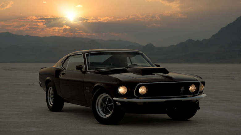 1969 Ford Mustang BOSS 429 at sunset, front-right 3/4 view