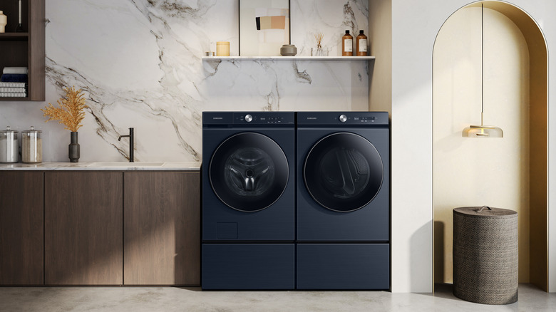 A pair of Samsung Bespoke HE washing machines in a well-lit room