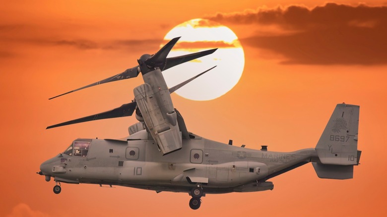 Military Helicopter in the air agaisnt the sunset