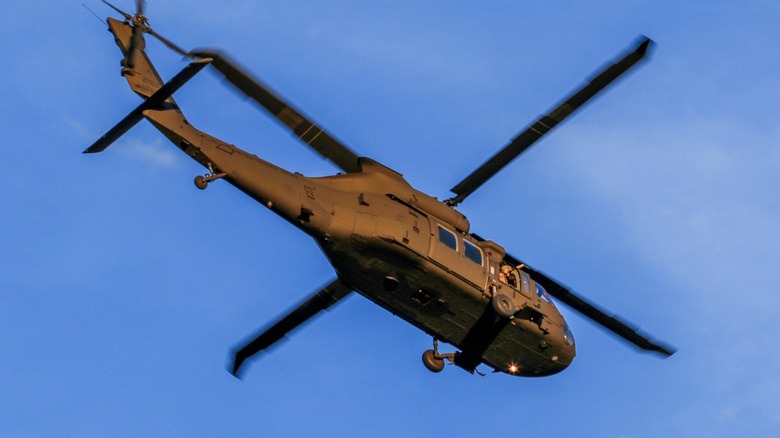 Military helicopter manuevering the skies
