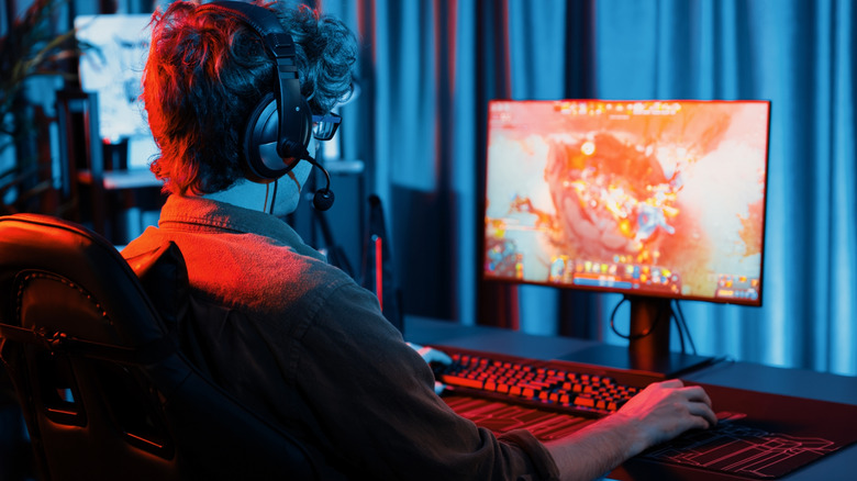 Gamer sitting at a desktop PC