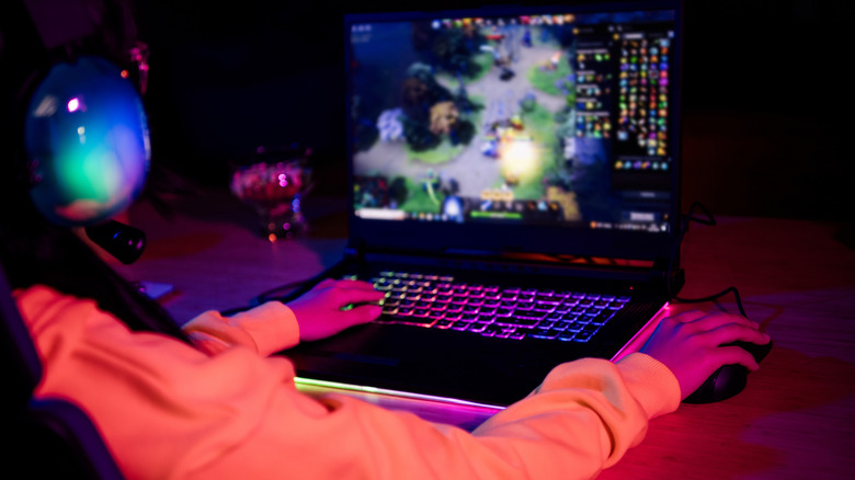 Person gaming on a laptop