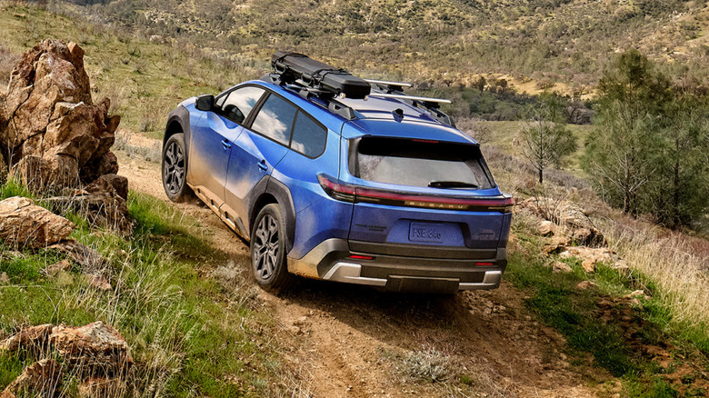 Blue 2026 Subaru Trailseeker climbing up rugged hill