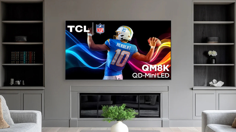 TCL QM8K TV mounted to a wall