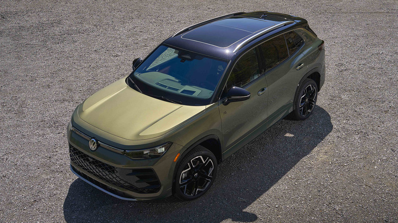 Avocado Green 2026 Volkswagen Tiguan SEL R-Line parked.