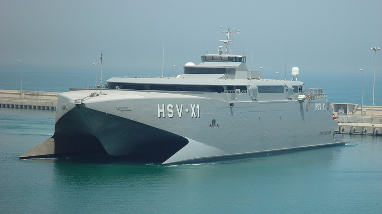 The HSV-X1 Joint Venture military catamaran docked in a port.