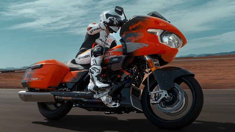 A side shot of a rider taking a corner on the 2025 Harley-Davidson CVO Road Glide RR on a track.