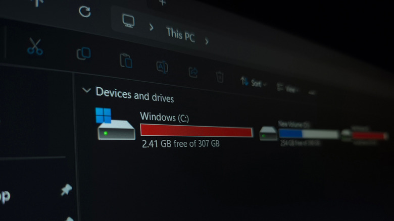 Windows 11 file explorer showing a nearly full C: drive with just 2.41 GB of free space