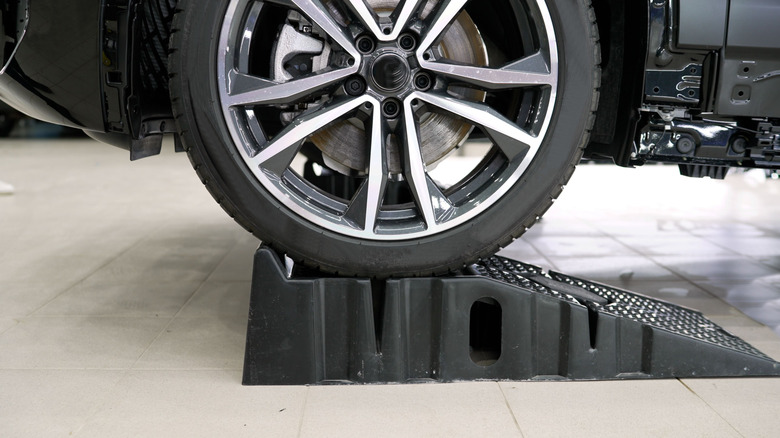 Close-up of car tire on top of car ramp