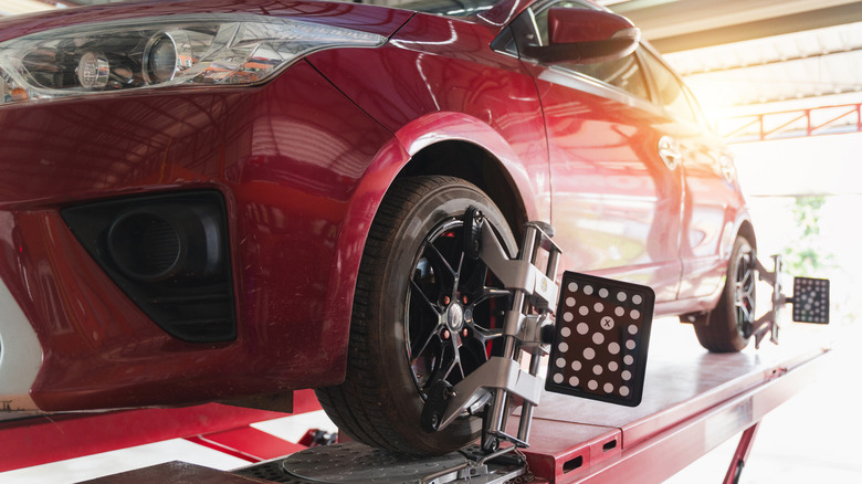 Close-up of car lift in residential garage, with car on top