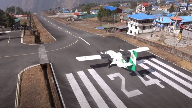 Propeller aircraft about to take off from Tenzing-Hillary airport