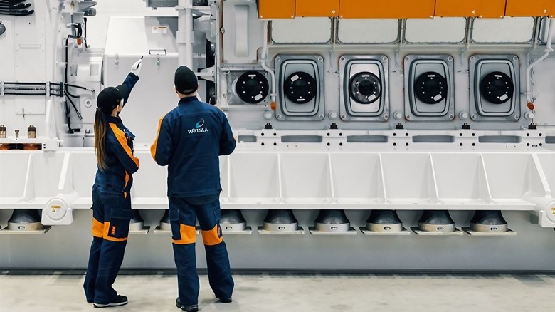 Wärtsilä technicians examine a power boosted version of the Wärtsilä 31 engine