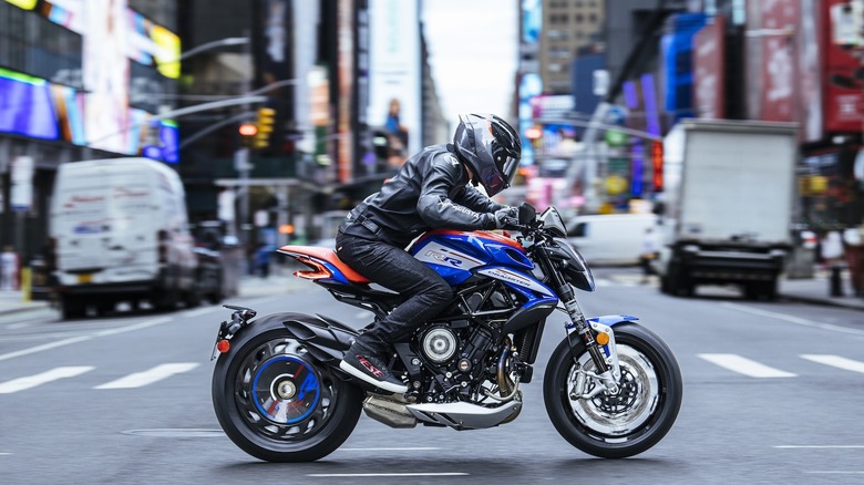 Person riding an MV Agusta Dragster RR SCS through the city.