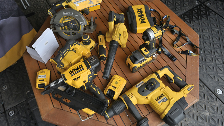 Several DeWalt tools on a table.