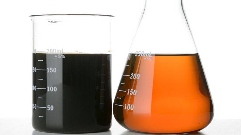 Used and fresh motor oil side-by-side